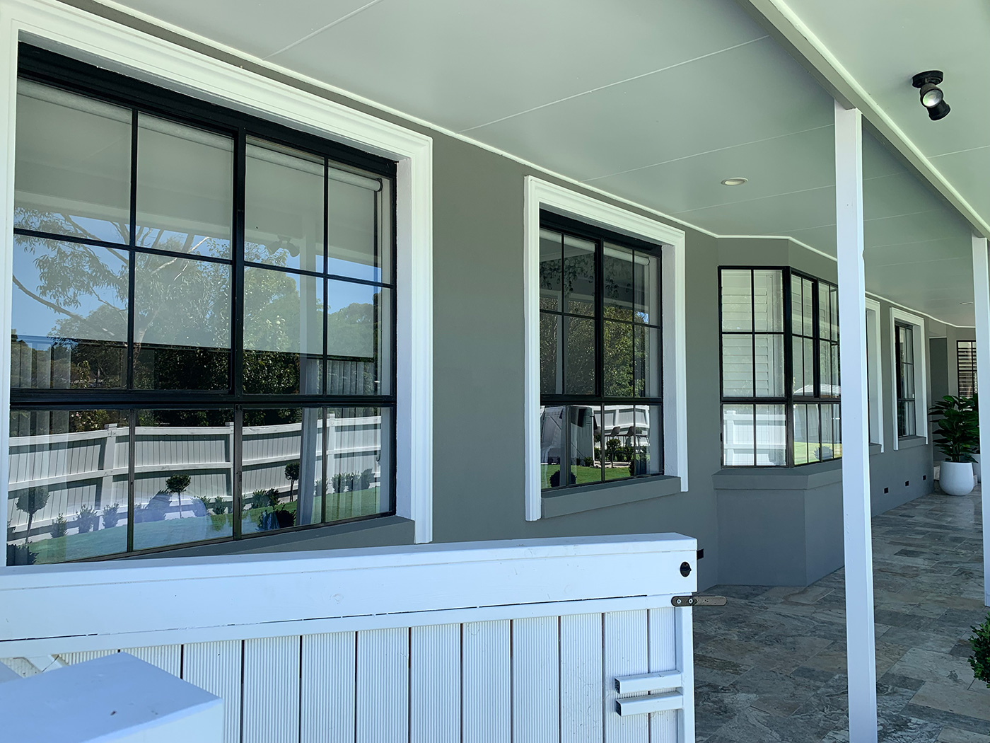 Windows along a covered residential verandah